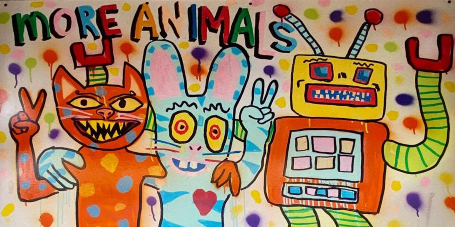 Colorful street art of an orange cat, blue rabbit with heart, and yellow robot with peace signs