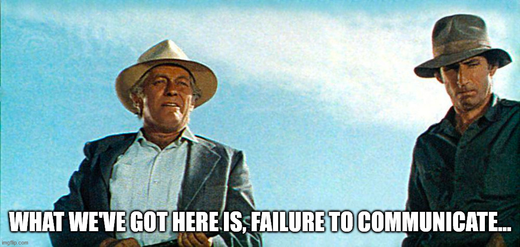 Two men in hats outdoors with caption 'What we've got here is failure to communicate'