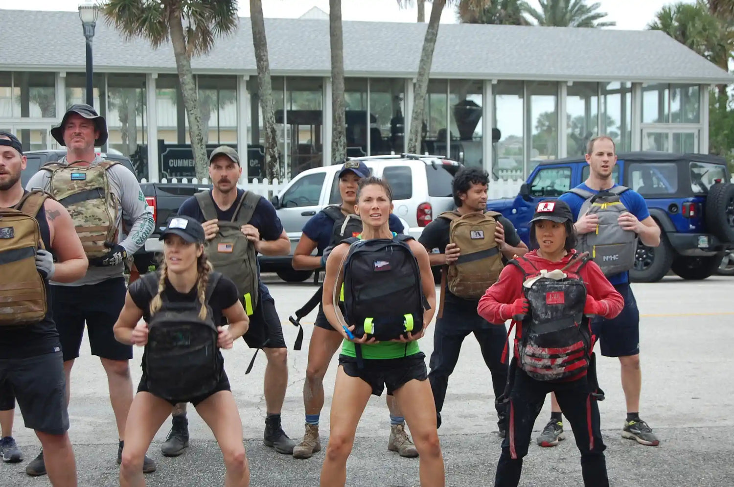 Group of people outdoors with GORUCK rucksacks during a rucking fitness event