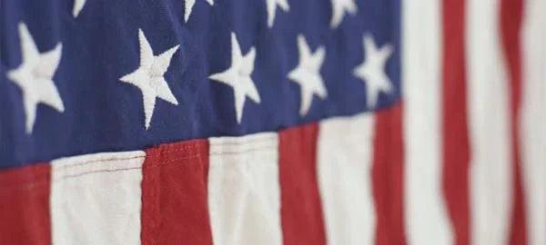 Close-up of stitched American flag with stars and stripes, symbolizing made in USA quality gear