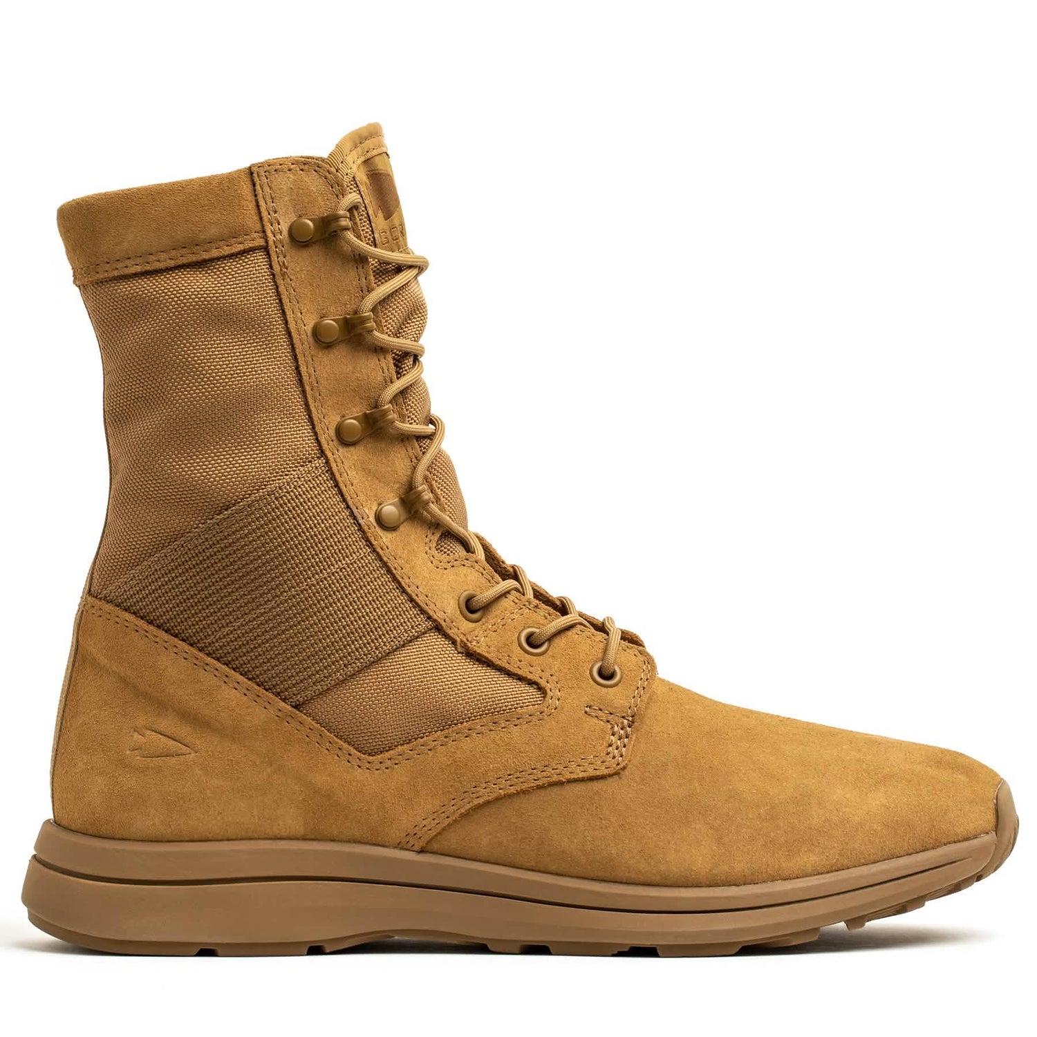 The MACV-1 Hi-Speed - High Top combat boot by GORUCK in tan features a high ankle, lace-up design, and reinforced eyelets. This AR670-1 compliant boot is equipped with a sturdy sole and a fabric panel on the side for enhanced flexibility and comfort, making it an ideal choice for those in search of lightweight rucking boots.