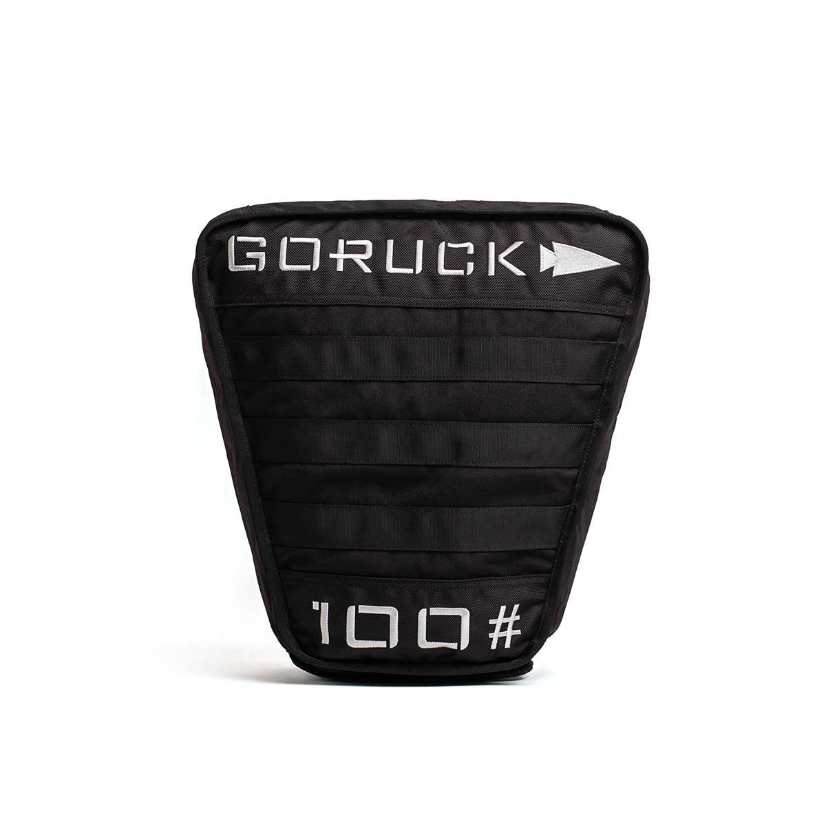 Black GORUCK 100lb weighted rucking plate with white logo and number on front