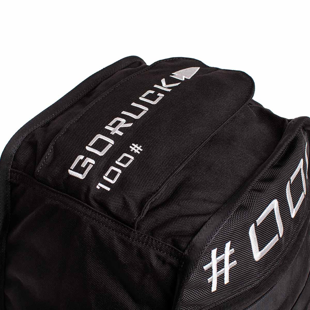 Black GORUCK 100lb weighted rucking bag with white embroidered logo and hashtag CZ7
