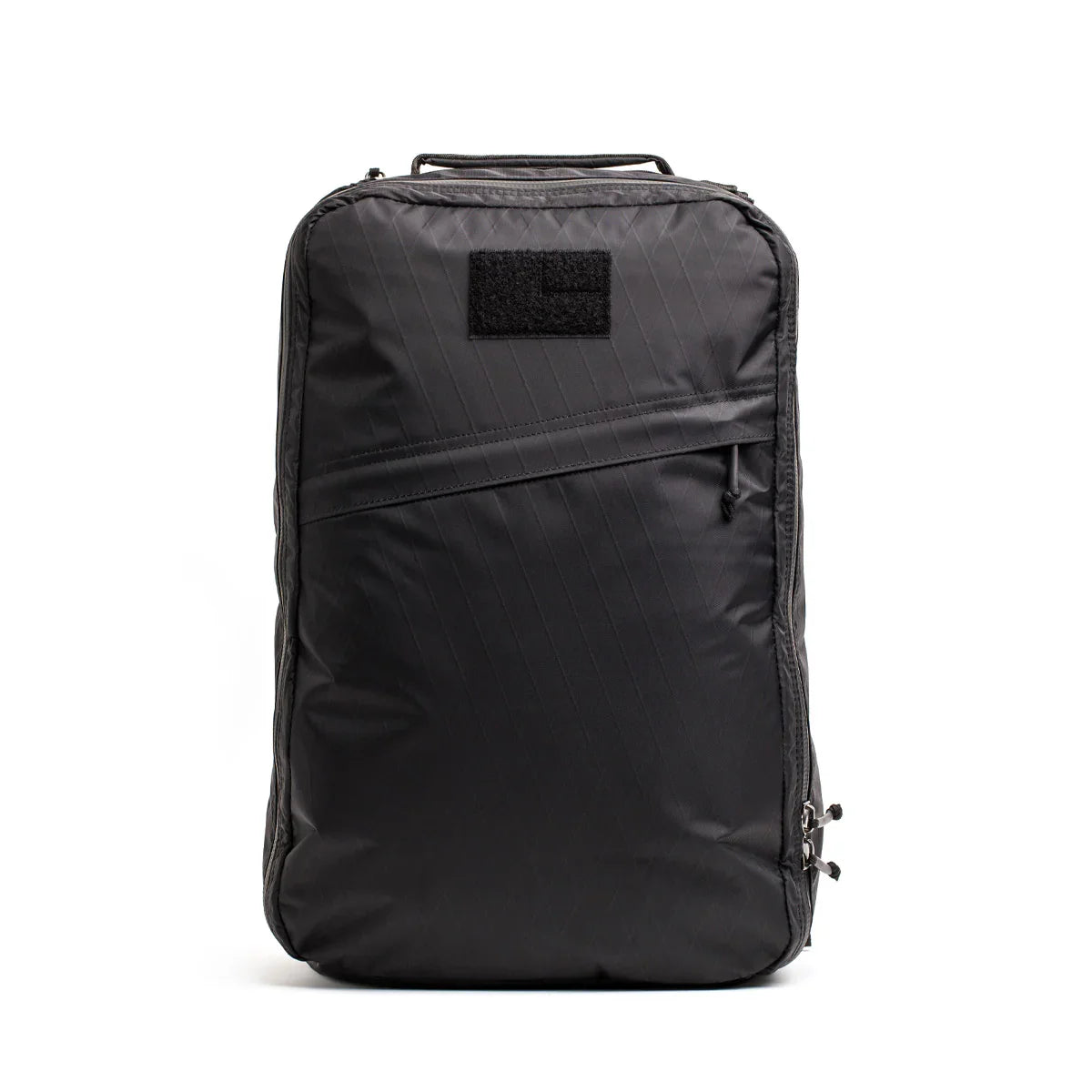Black GORUCK rucksack with diagonal front zipper and top handle on white background