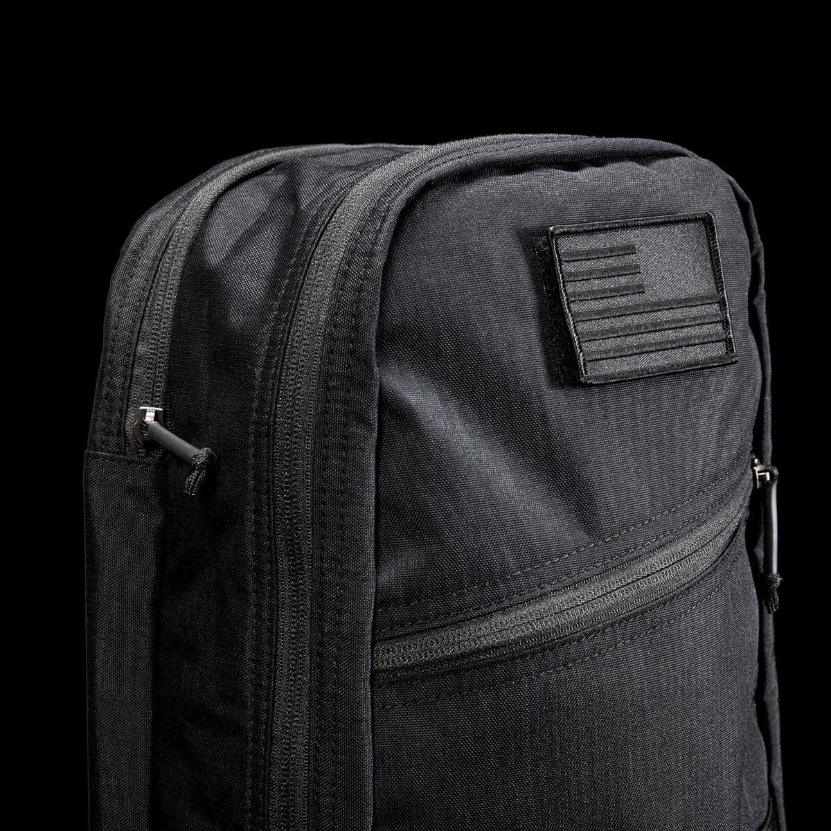Black GORUCK 15L Bullet 2-compartment tactical rucksack with diagonal zipper and American flag patch
