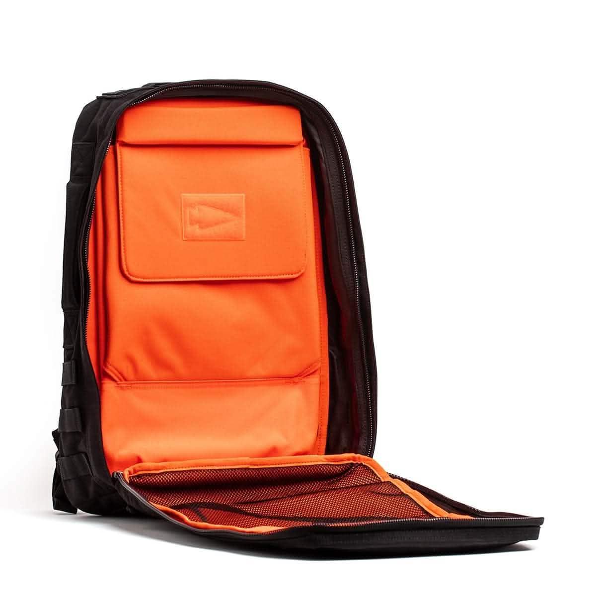 GORUCK rucksack open with bright orange interior and multiple compartments
