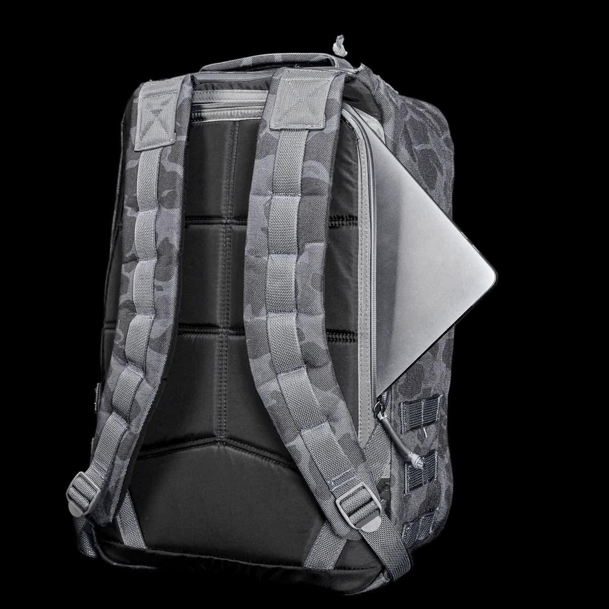 GORUCK Frogskin Black tactical backpack with padded straps and laptop compartment against black background