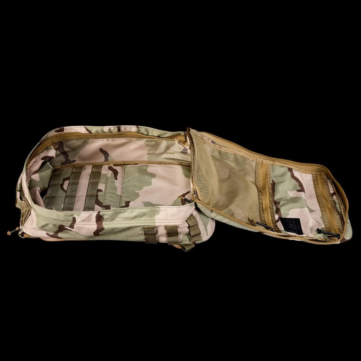 Open GORUCK rucking pack with multicam camouflage interior and mesh zippered compartments
