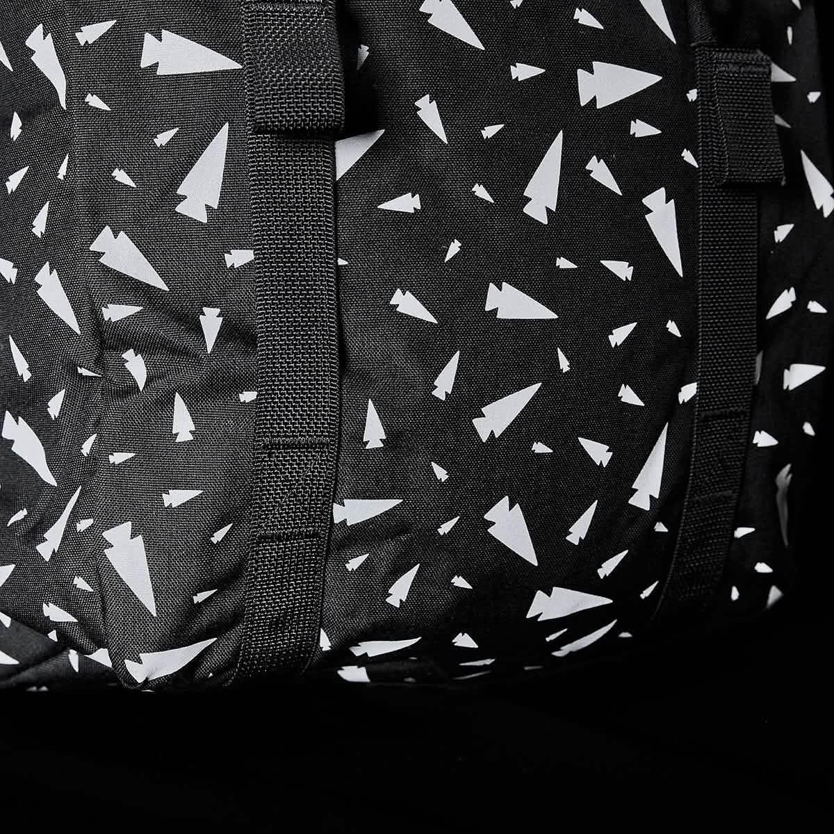 The M23 - Ballistic Nylon Cordura is a black and white bag featuring white arrows, built with durable materials for modern everyday adventures.