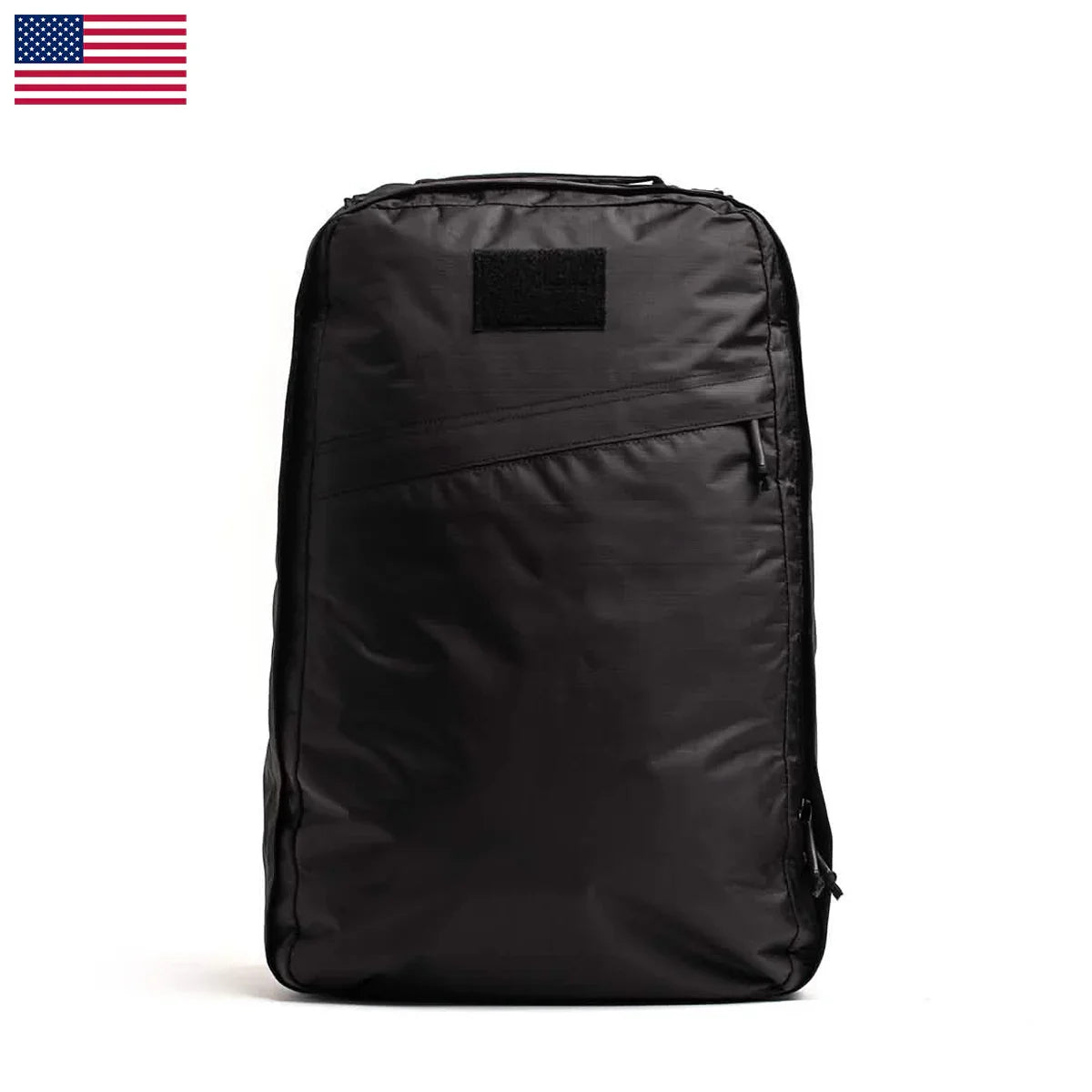 Black durable GORUCK rucksack with angled front zipper pocket and Velcro patch on top, white background