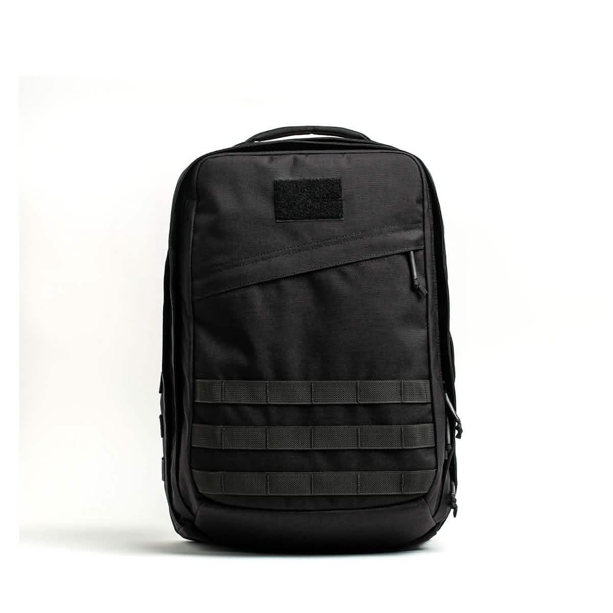 GORUCK black tactical rucksack with padded handle and MOLLE webbing on front against white background