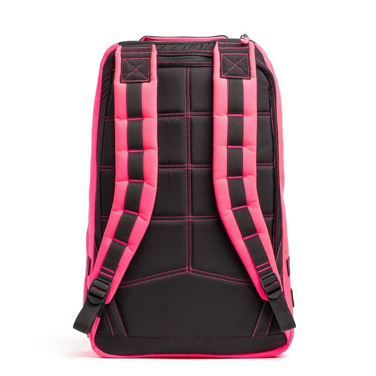 Back view of black and hot pink GORUCK rucksack with padded shoulder straps and reinforced stitching