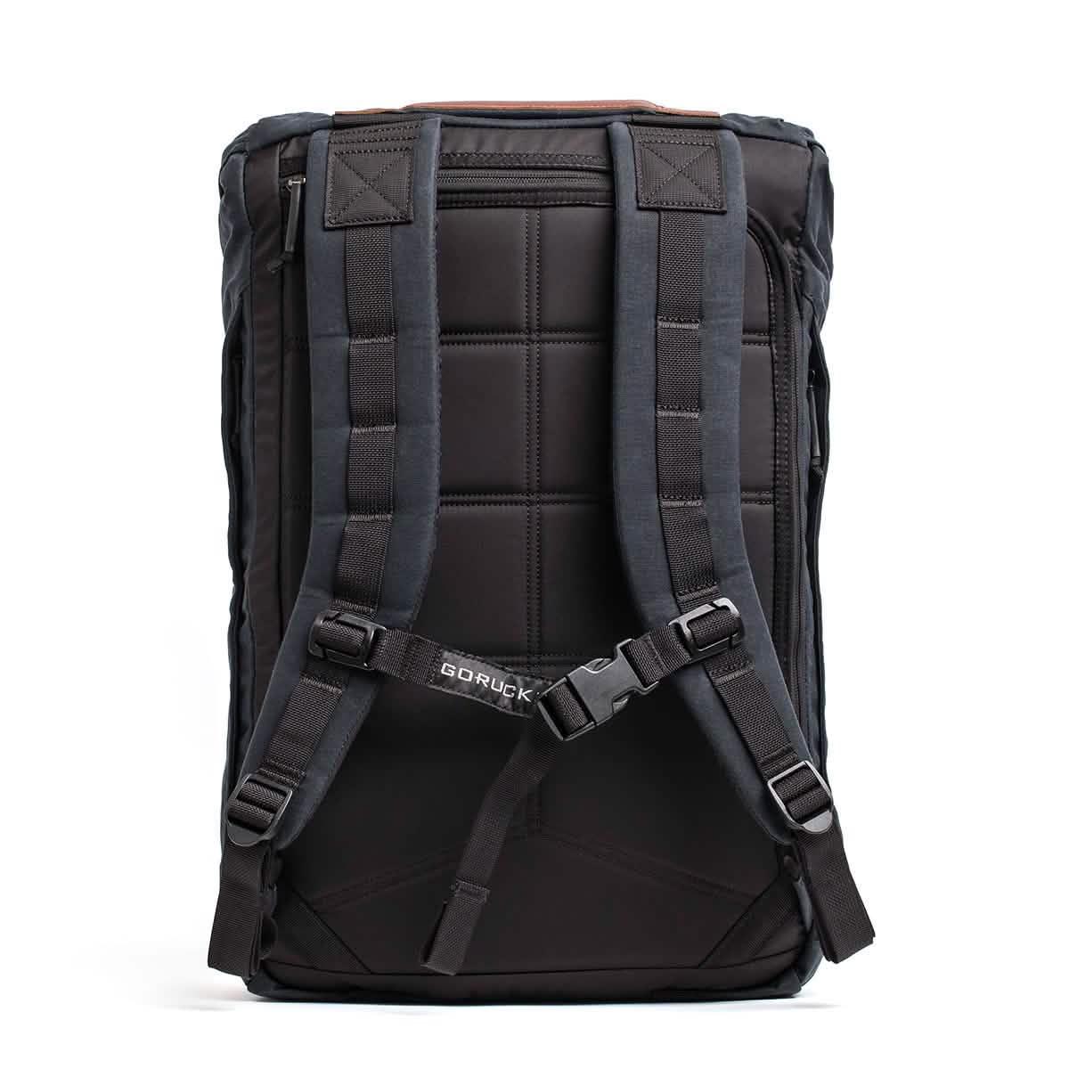 Black GORUCK backpack shown from back with padded straps and secure buckle, durable rucking gear