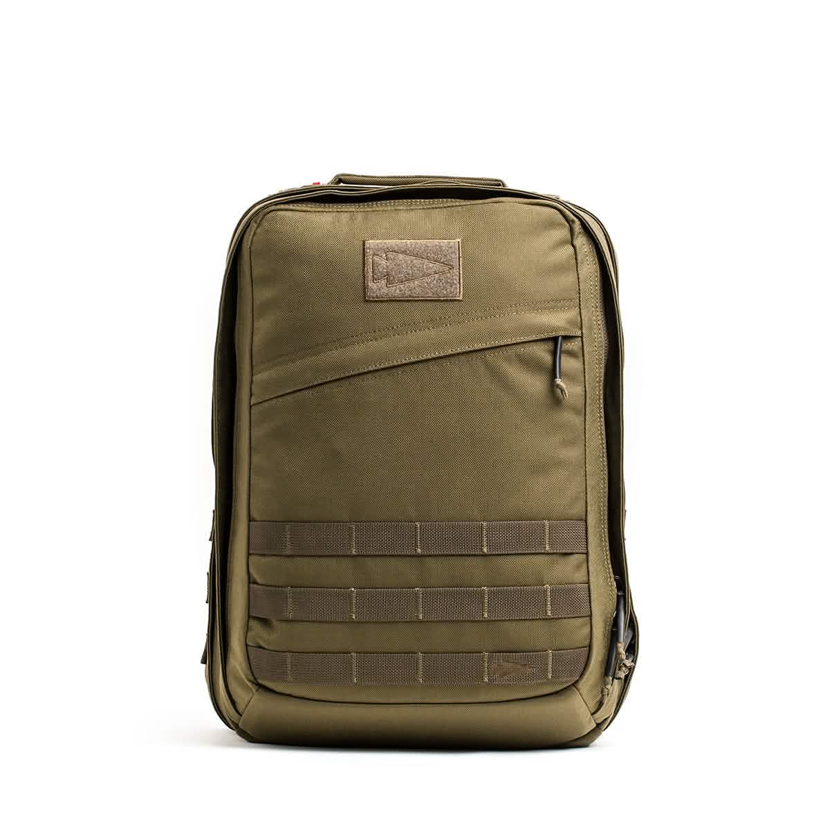 Introducing the GR2 - Cordura by GORUCK: a durable green tactical ruck featuring multiple compartments and a top handle. This rugged bag includes a front zipper pocket, MOLLE webbing for attachments, and draws inspiration from Special Forces design. It's meticulously crafted for durability and functionality, making it ideal for outdoor or tactical use.