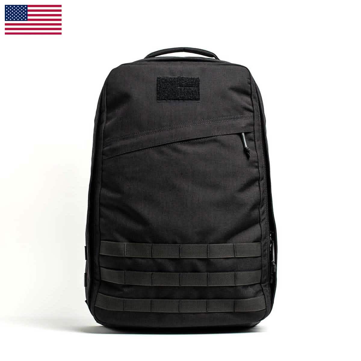 The GR1 USA - Cordura (The Original Ruck) by GORUCK is showcased against a plain white background, highlighting its black tactical design with precision craftsmanship in American manufacturing, MOLLE webbing, and a small USA flag in the top corner.