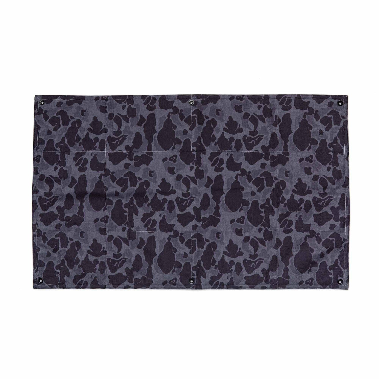 The GORUCK Patch Board is a rectangular Cordura fabric panel featuring a black and dark gray camouflage pattern and corner metal grommets.