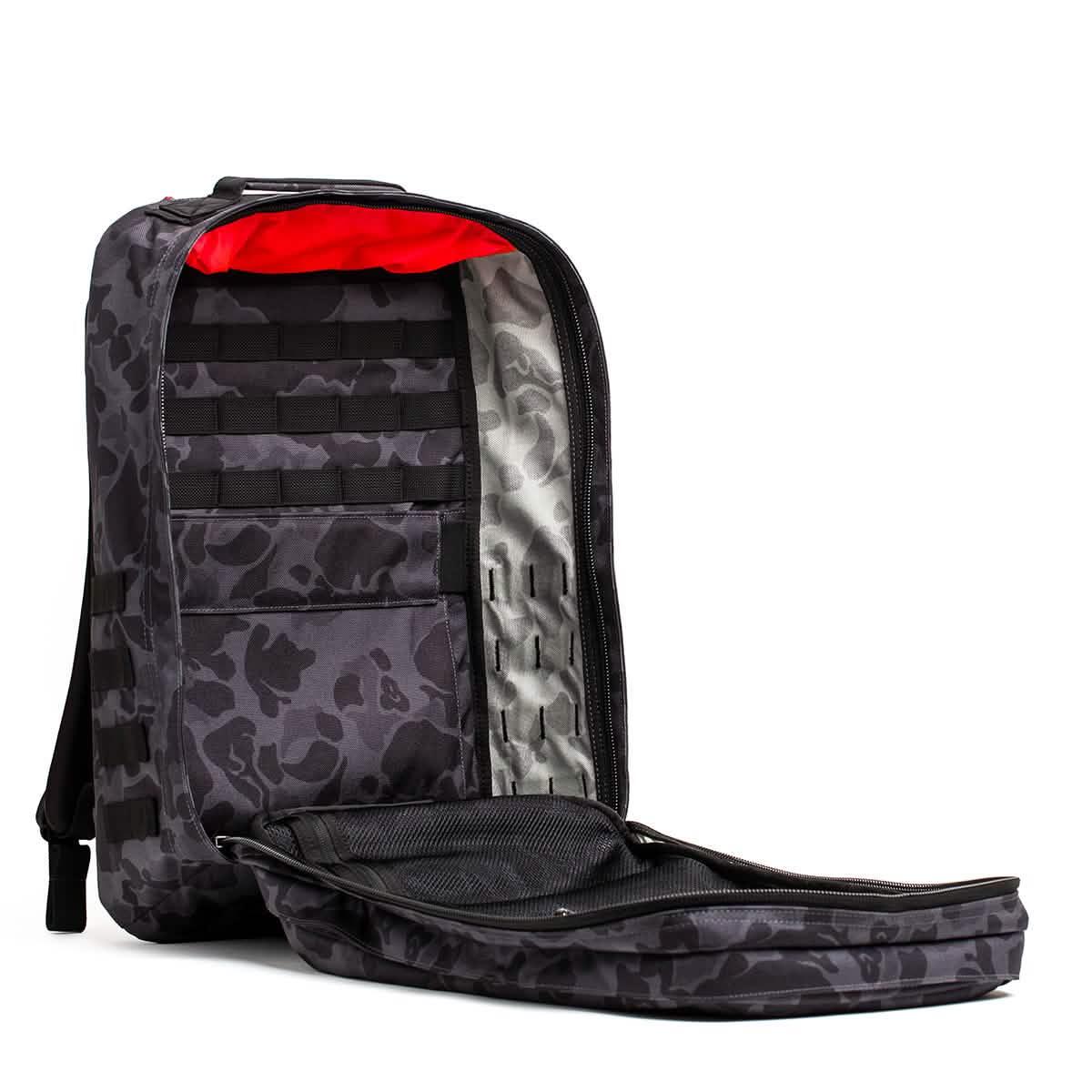 GORUCK black Frogskin rucksack open showing organized interior with red lining and multiple compartments