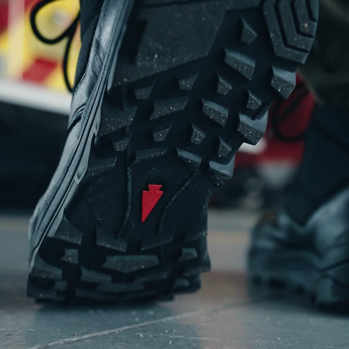 GORUCK tough rucking boot with rugged black outsole and red arrow detail, close-up view