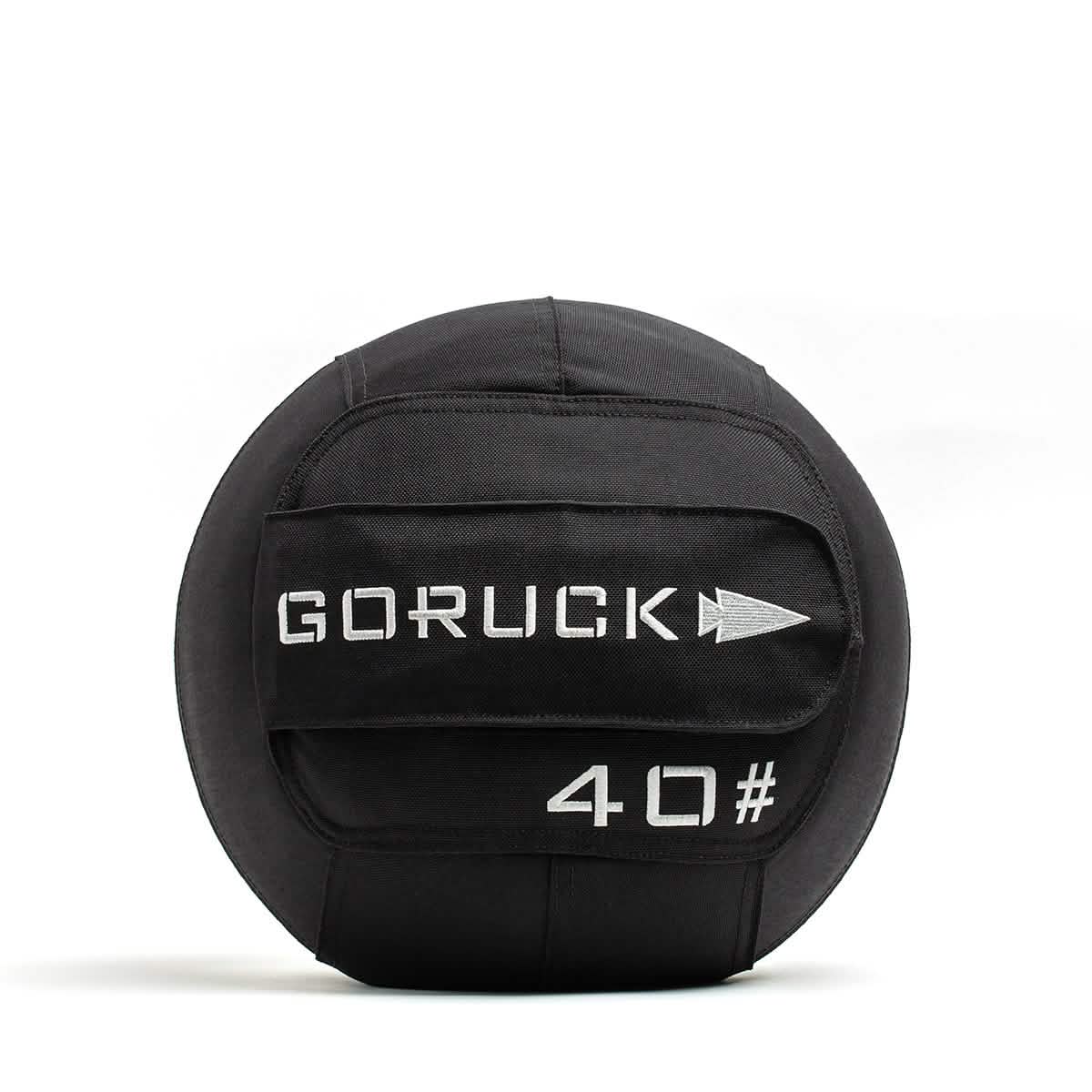 The GORUCK Sand Medicine Ball, featuring a black design with a top handle and white text displaying GORUCK and 40# on the side, is perfect for your home gym. Ideal for strength training and core stability, this versatile tool enhances any workout routine.