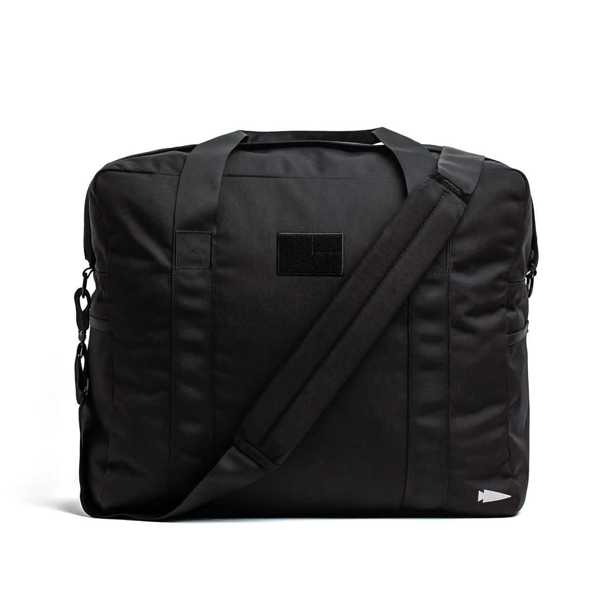 GORUCK black tactical ruck bag with shoulder strap on white background