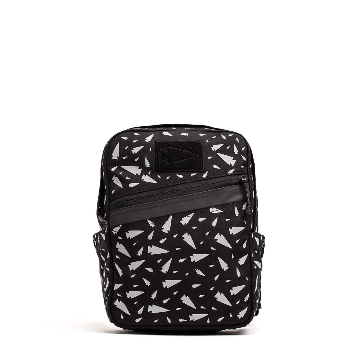 Black GORUCK rucksack with white geometric tree pattern and diagonal front zipper pocket