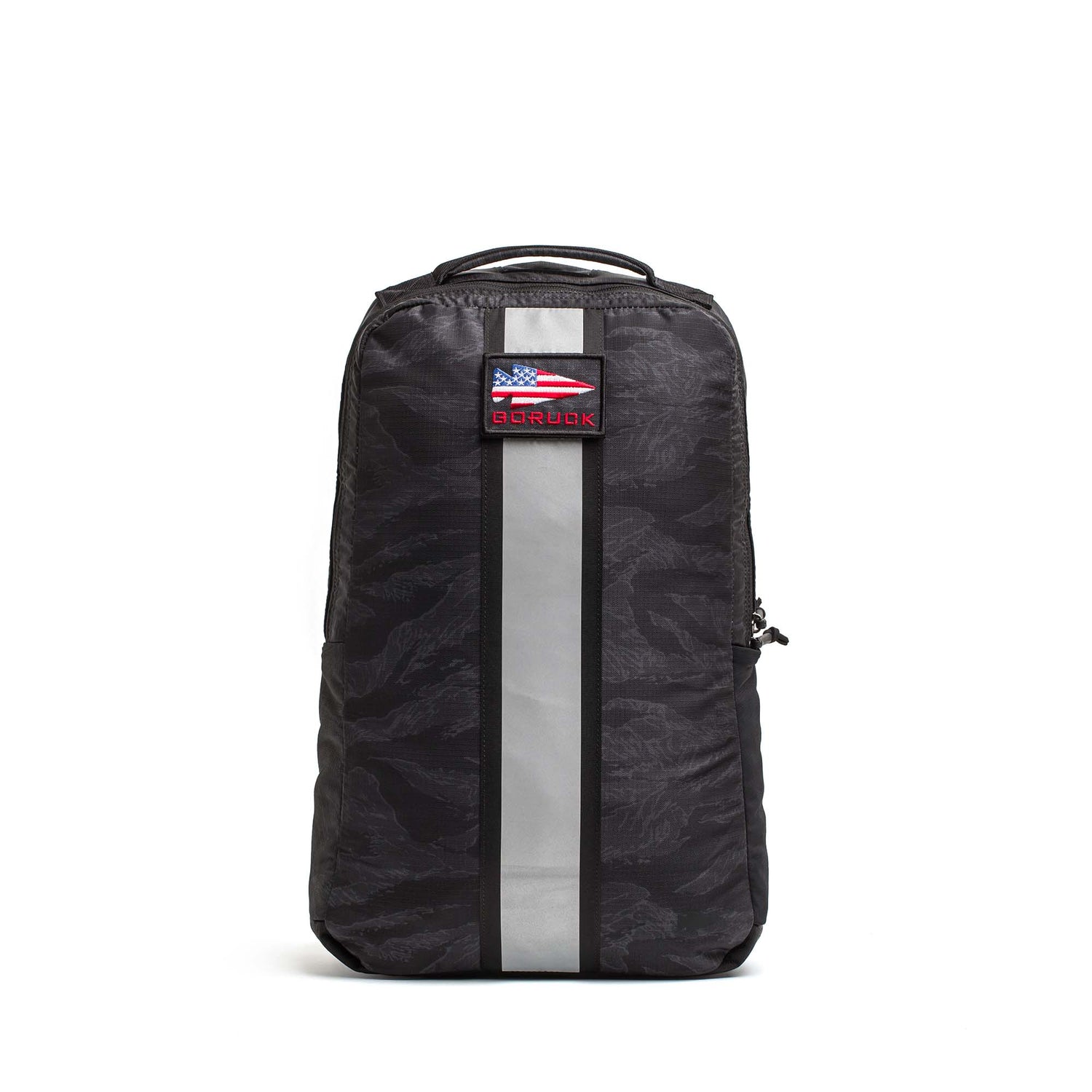 The Basic Rucker is a black GORUCK backpack featuring a gray vertical stripe, camouflage pattern, and an American flag patch on the front—ideal for everyday adventures.