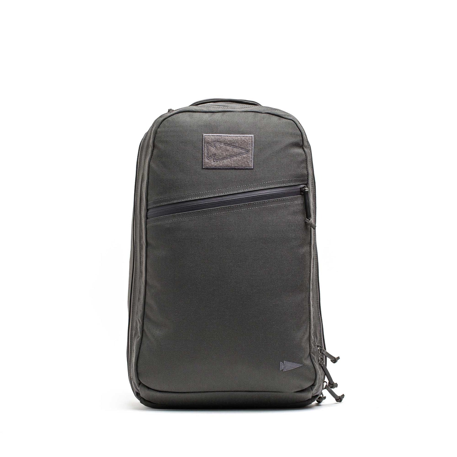 The Double Compartment Bullet Ruck - Ballistic Nylon Cordura - 18L is a sleek black travel backpack featuring a bombproof laptop compartment and front zipper pocket, displayed standing upright against a white background.