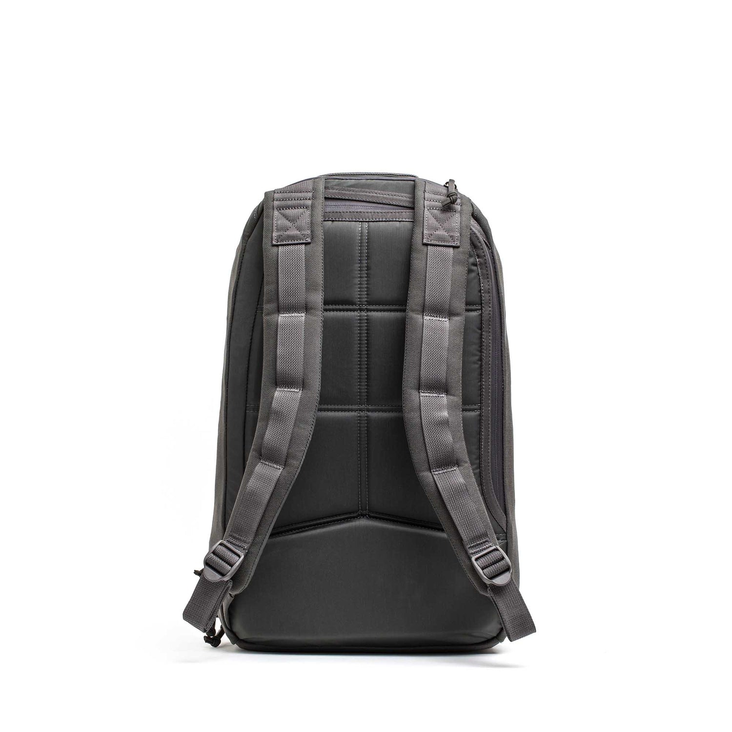 The Double Compartment Bullet Ruck - Ballistic Nylon Cordura - 18L is a black travel backpack with padded shoulder straps, a padded back panel, and a bombproof laptop compartment for secure journeys.