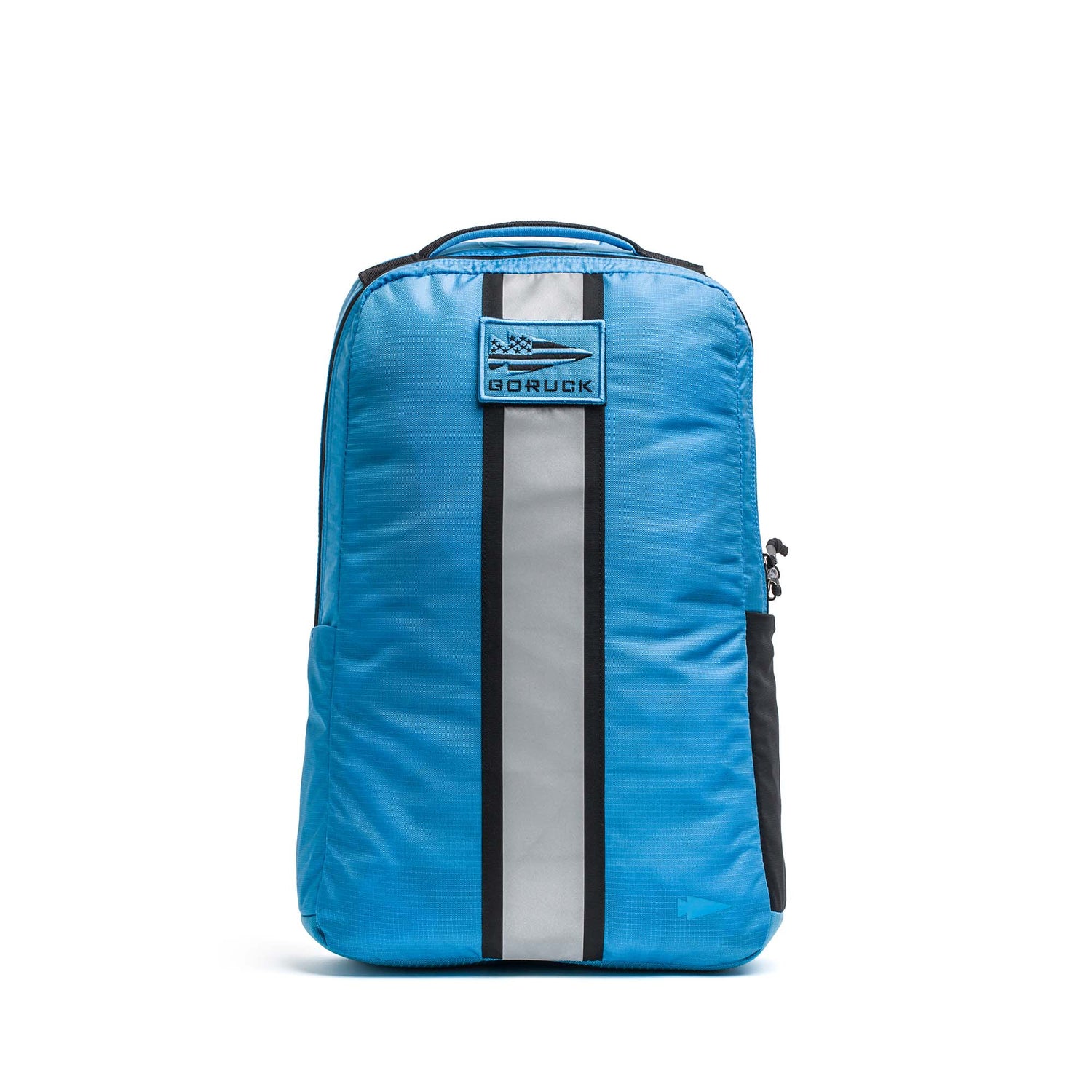 The Basic Rucker® is a bright blue backpack with a reflective vertical stripe and front GORUCK logo patch—ideal for rucking or daily use.