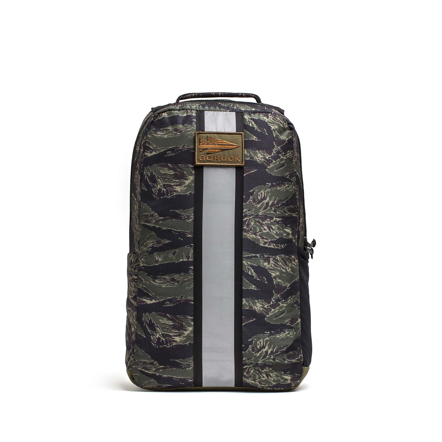 The Basic Rucker® features a camouflage pattern, vertical reflective stripe, tan front logo patch, and is designed to carry a Ruck Plate®.