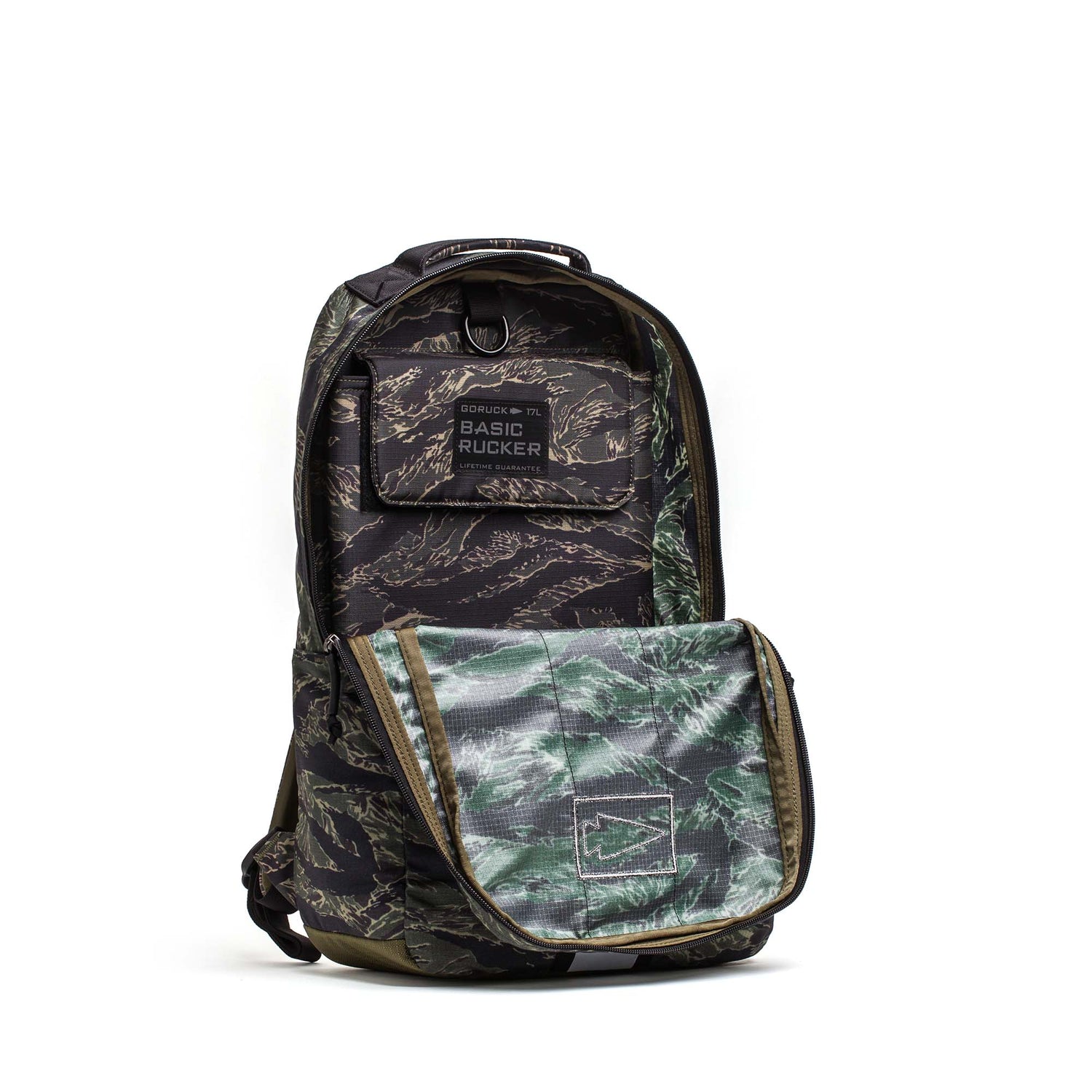 The Camouflage-patterned Basic Rucker® backpack features a front pocket, a