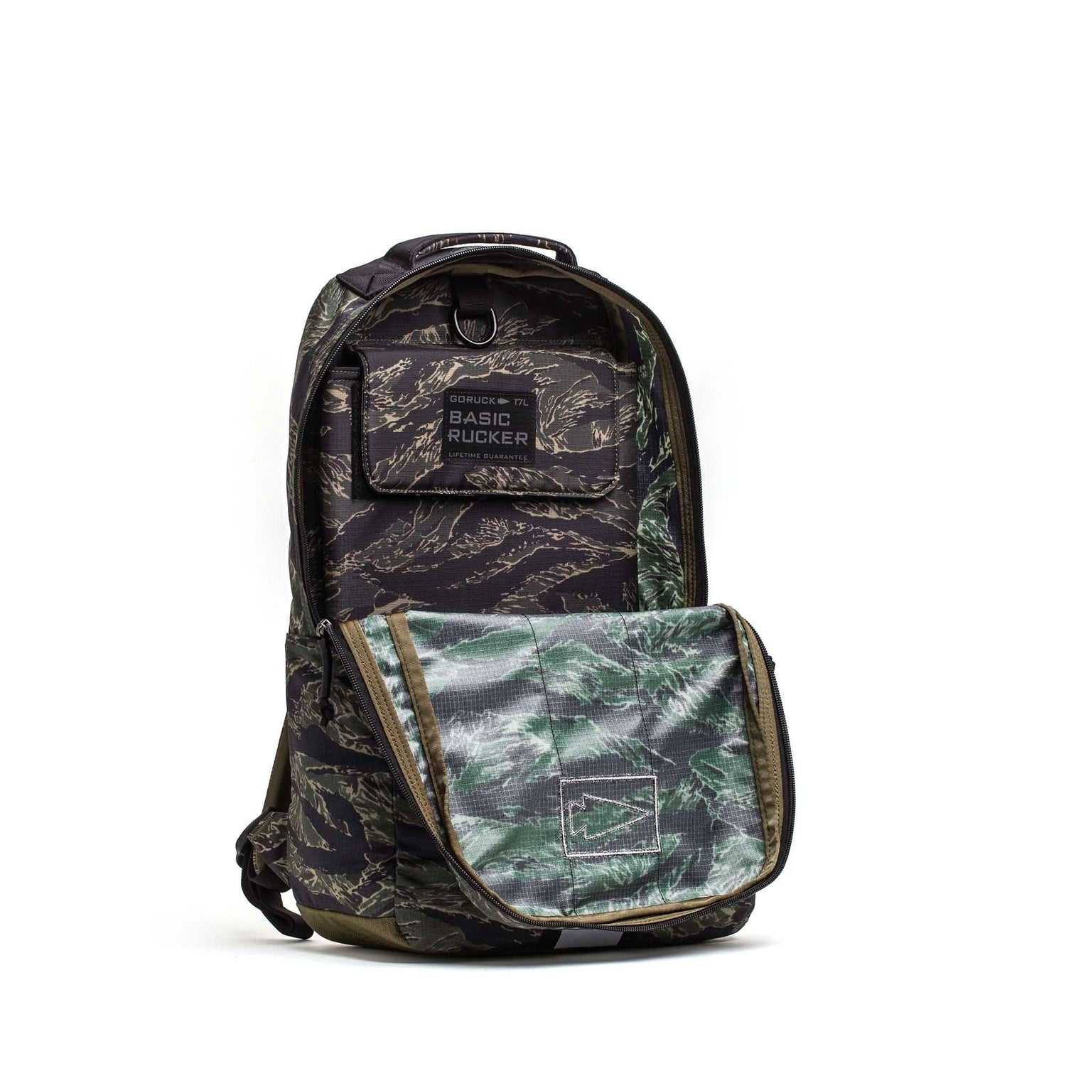 GORUCK Basic Rucker 17L backpack in tiger stripe camouflage, open to show interior pocket.