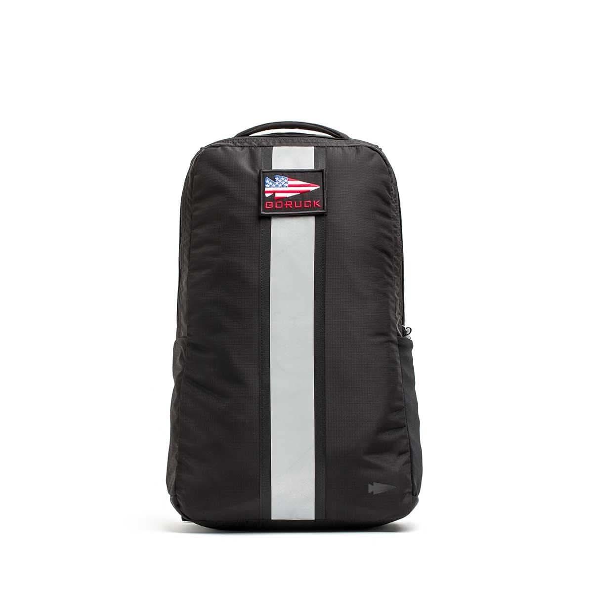 Black GORUCK Basic Rucker backpack with white vertical stripe and American flag patch on front