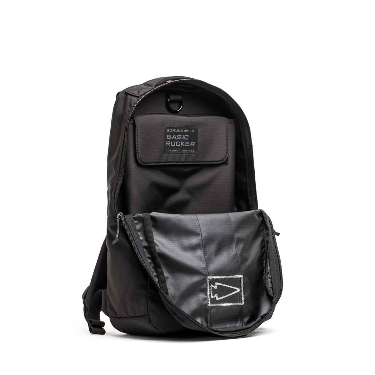 GORUCK Basic Rucker black rucksack with open front flap showing interior details.