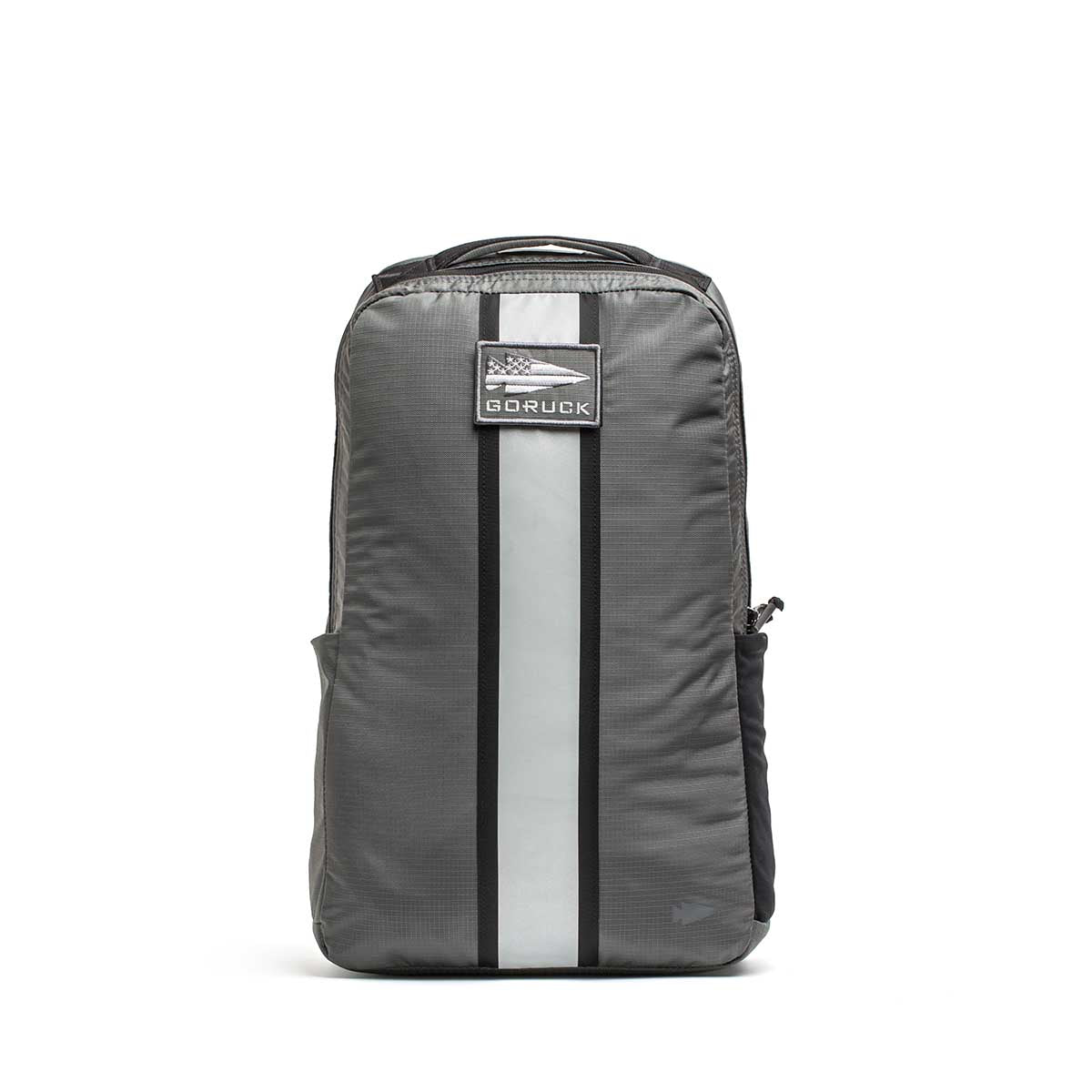 A gray Basic Rucker® backpack with a vertical reflective stripe and front patch, designed for weighted rucking, shown on a white background.
