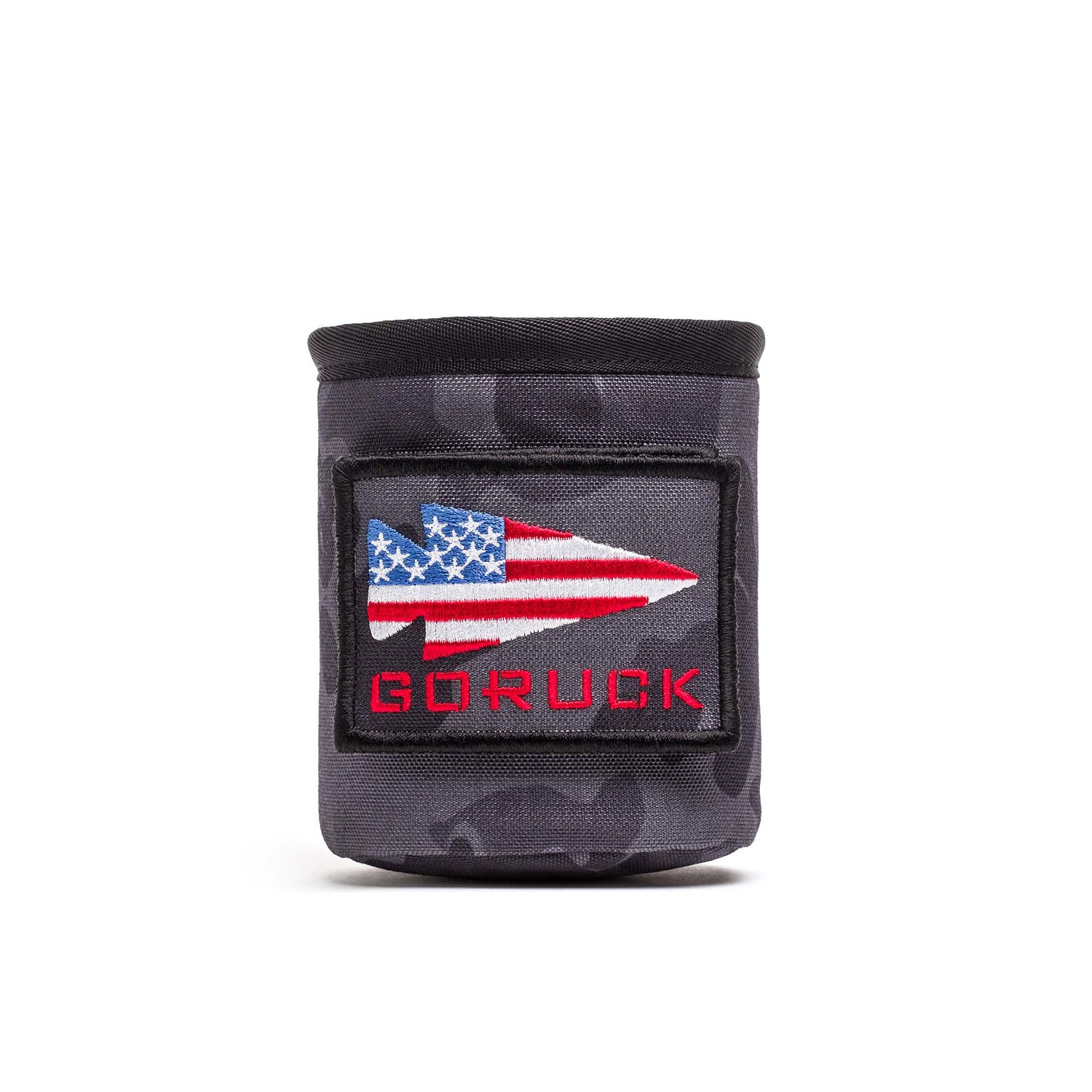 The Ballistic Beer Jacket is a black beer koozie crafted from rugged 1000D CORDURA, featuring an American flag spearhead patch and bold red