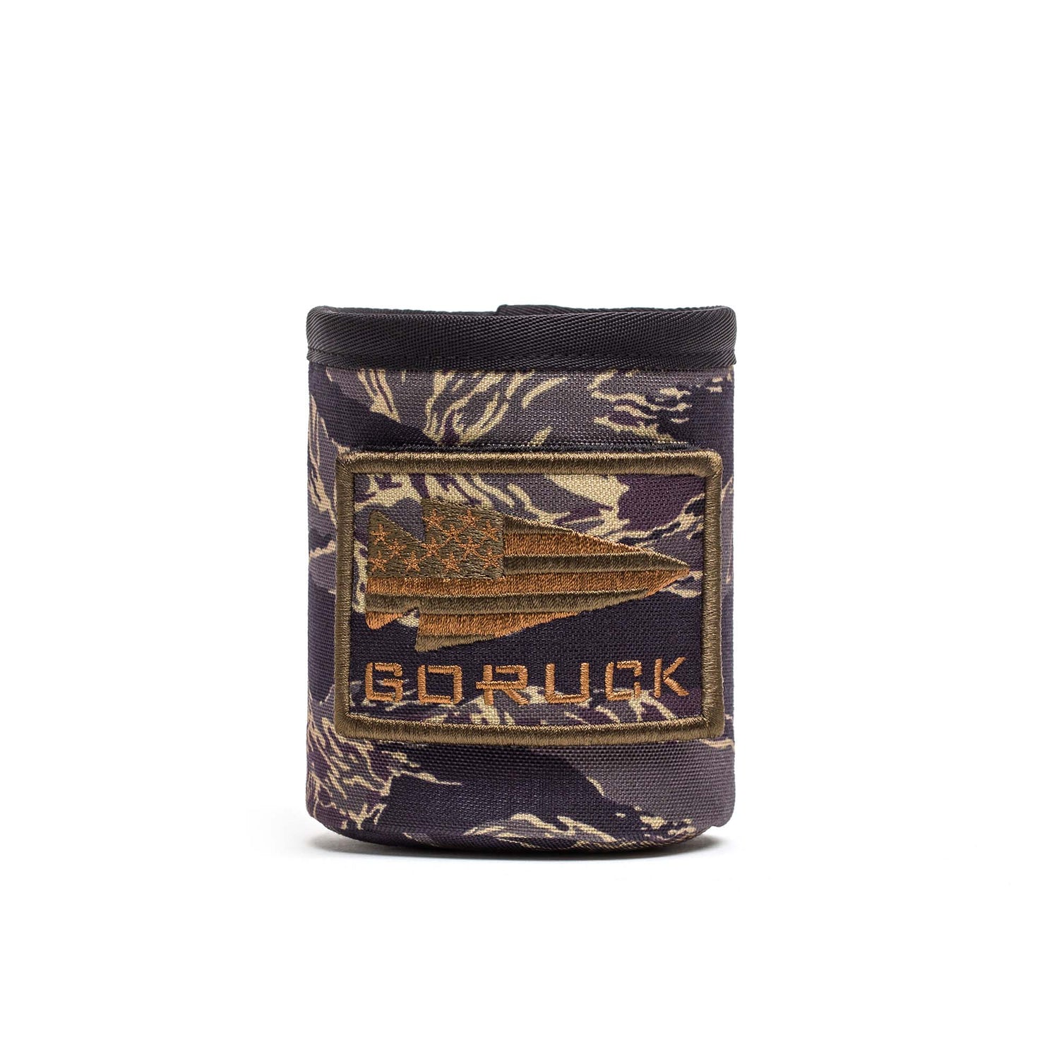 The Ballistic Beer Jacket - GORUCK is a camouflage-patterned koozie made from tough 1000D CORDURA, featuring an American flag spear patch and