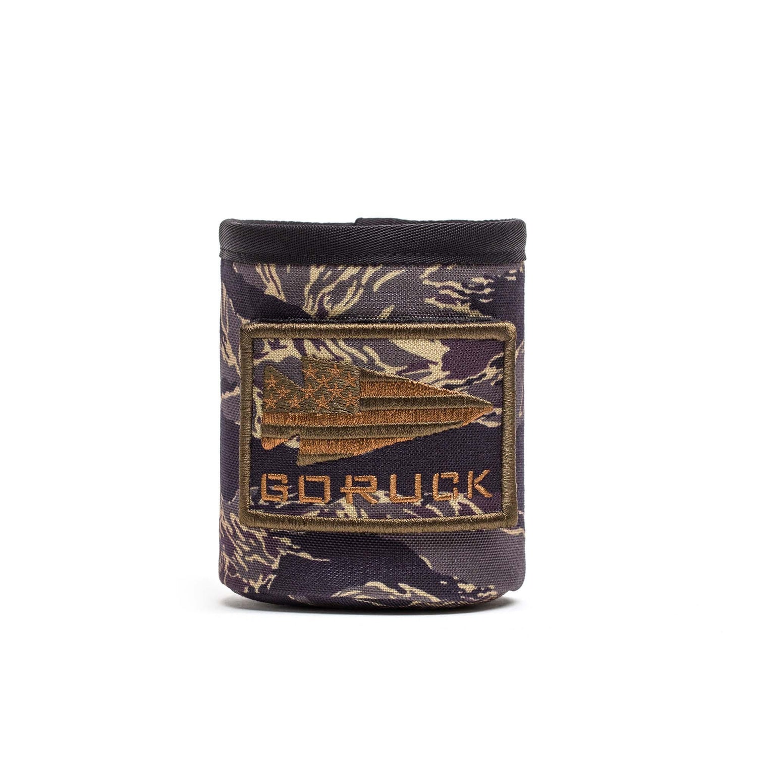 The Ballistic Beer Jacket - GORUCK is a camouflage-patterned koozie made from tough 1000D CORDURA, featuring an American flag spear patch and