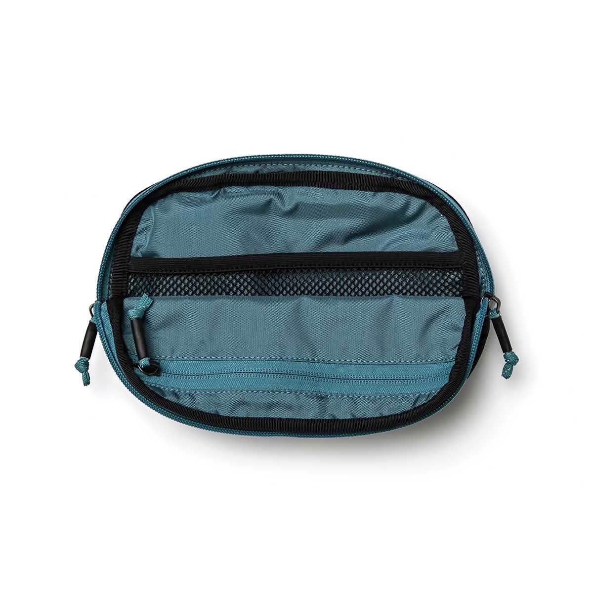 GORUCK large belt bag in teal open to show interior compartments and zipper pocket