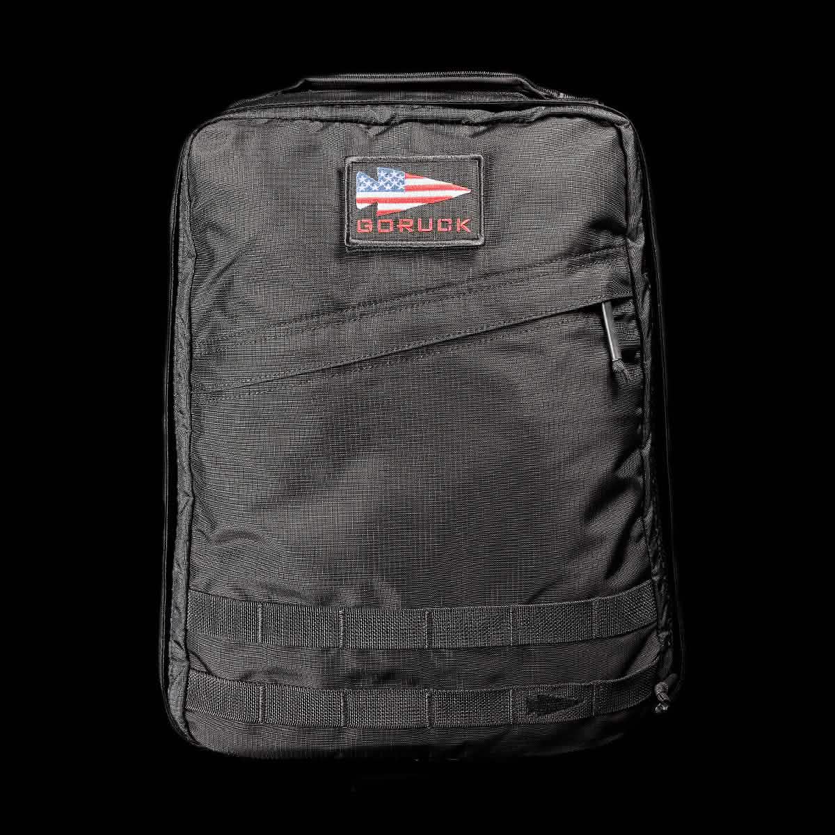 The GR0 - Ripstop ROBIC® is a black, water-resistant tactical backpack with an American flag GORUCK patch on the front, ideal for minimalist everyday carry, shown against a black background.
