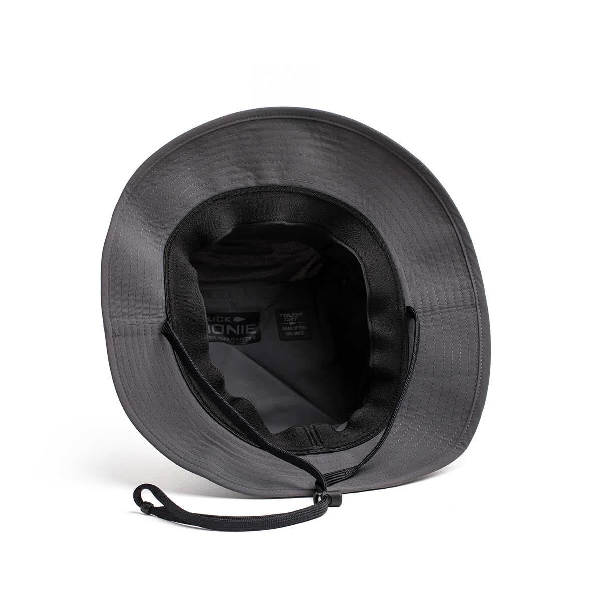 Top-down view of black rugged GORUCK boonie hat with adjustable chin strap on white background