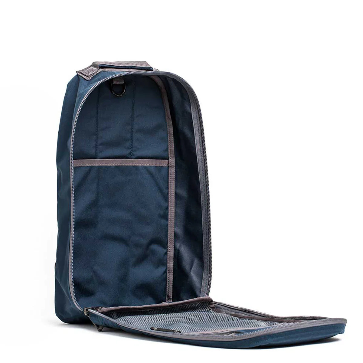 Open dark sea blue GORUCK Bullet 15L rucksack showing interior with armor grey trim and mesh pocket