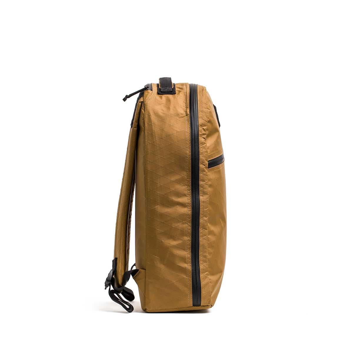 GORUCK coyote brown rucksack side view with black zipper, tough rucking backpack