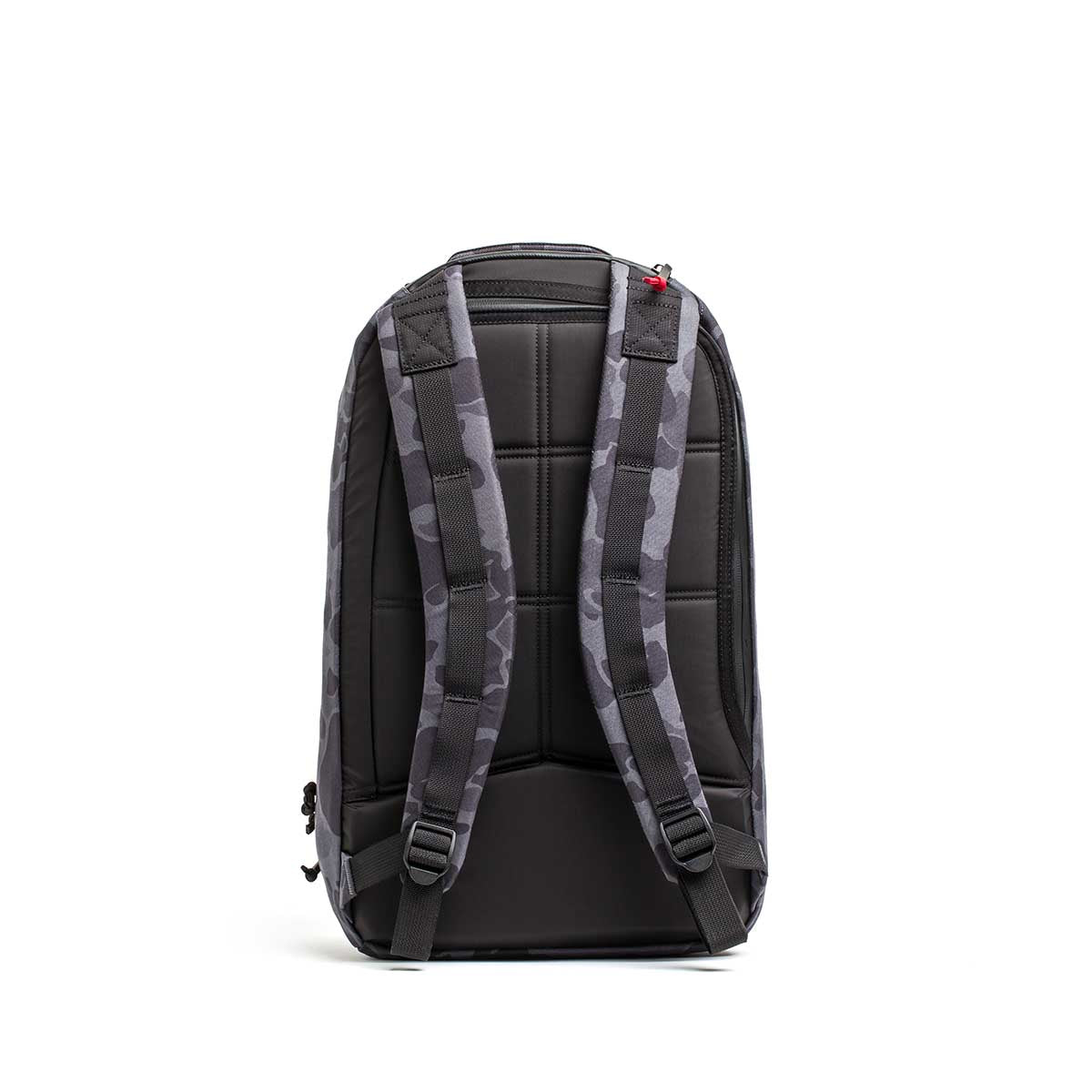 The Double Compartment Bullet Ruck - Ballistic Nylon Cordura - 18L is shown from the back in gray camo, featuring padded straps, a quilted back panel, and a bombproof laptop compartment.