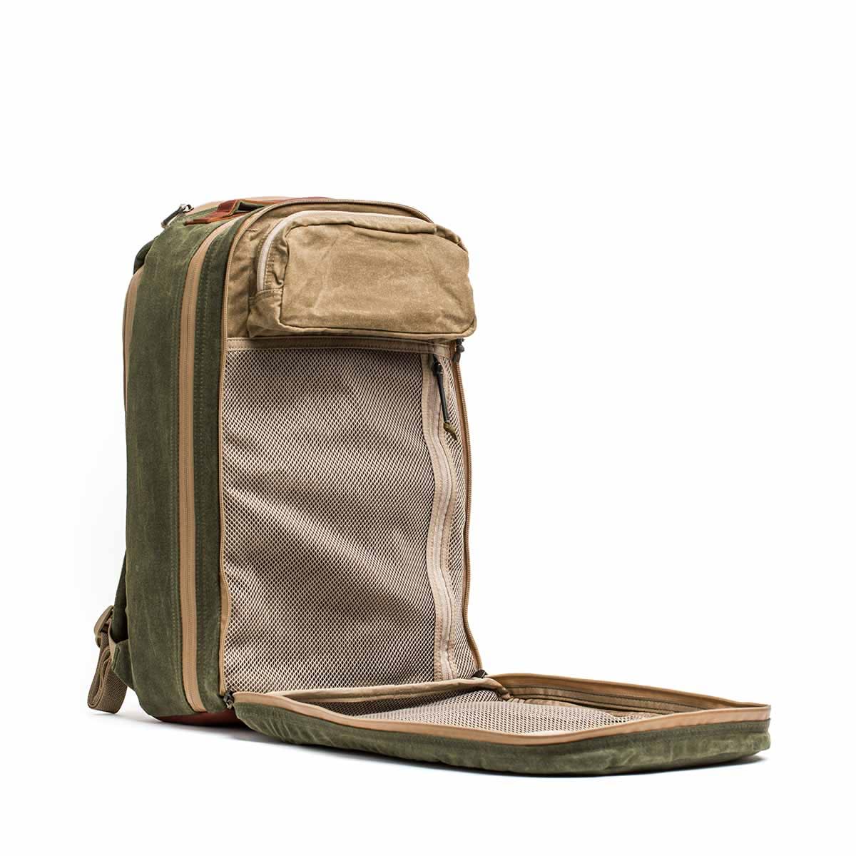 Discover versatility and style with the open 18L Waxed Canvas Bullet Ruck in olive and tan, featuring a mesh pocket. Benefit from dual compartments for organized packing and enjoy Scars Lifetime Guarantee for peace of mind.
