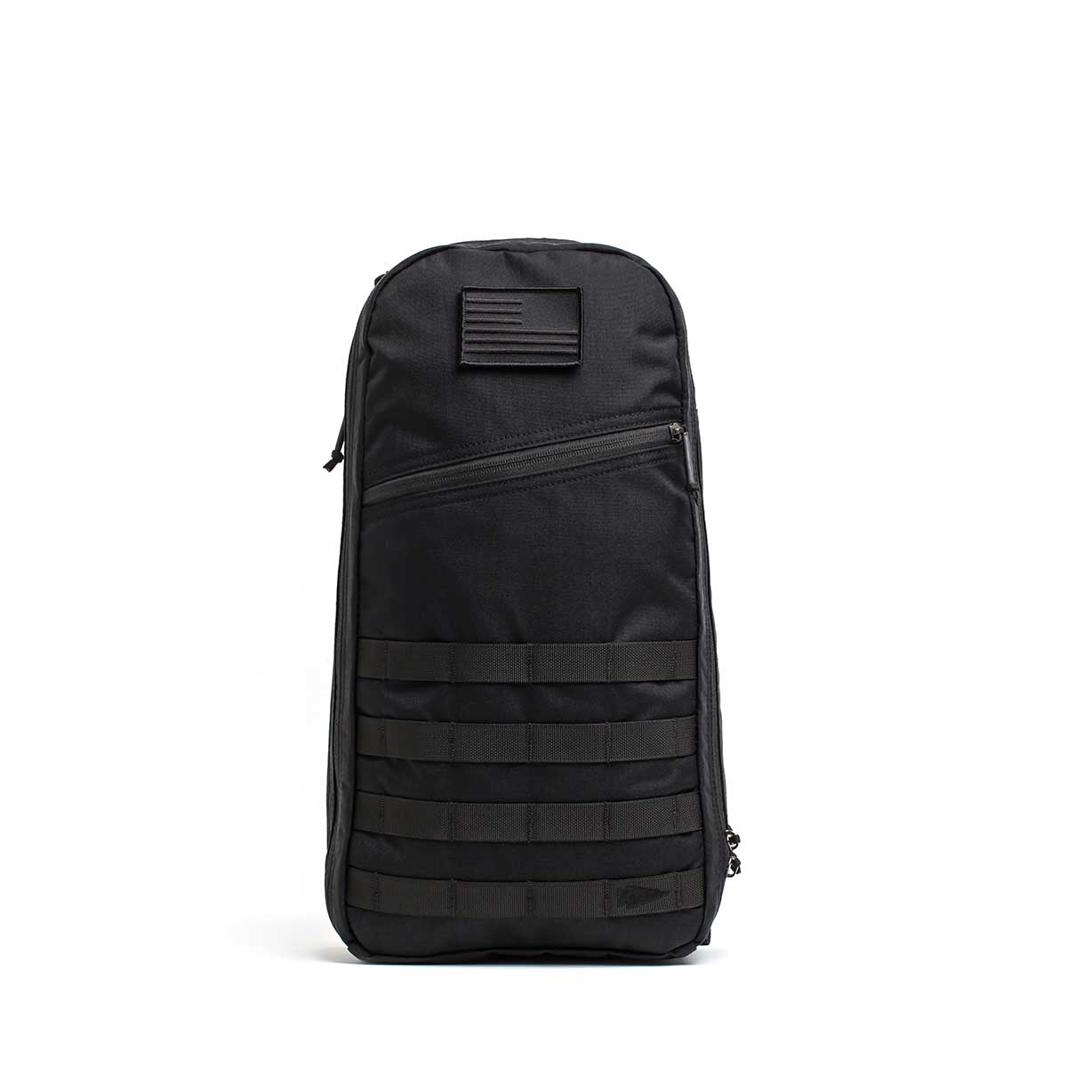 The Bullet Ruck USA Throwback is a black tactical daypack made with durable CORDURA fabric, featuring MOLLE webbing, a front zipper pocket, and a patch, displayed on a plain white background.