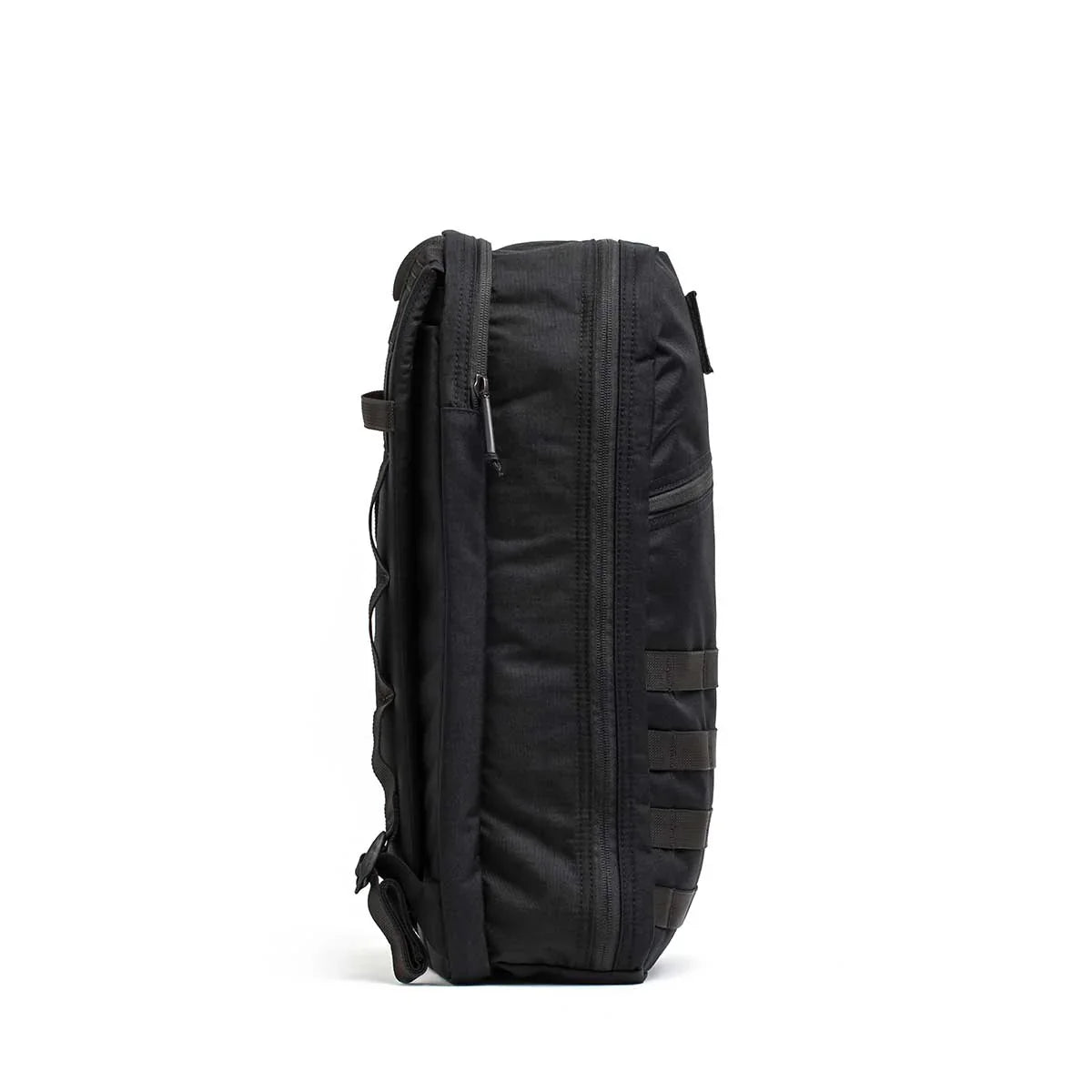 Side view of a black GORUCK Bullet Ruck 15L backpack with durable zippers and MOLLE webbing