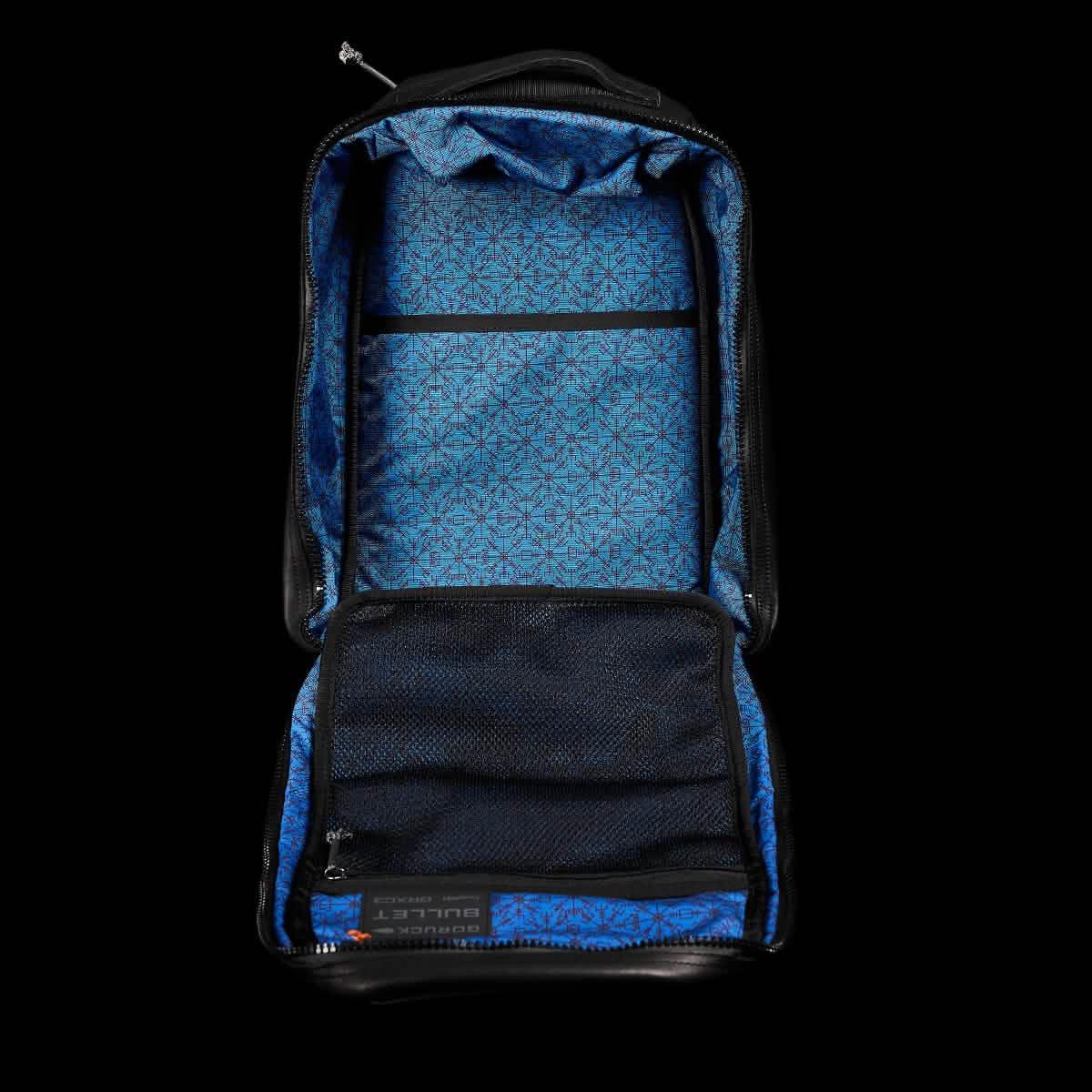 Open GORUCK black rucksack showing blue patterned interior with mesh zippered pocket and organizer sleeve