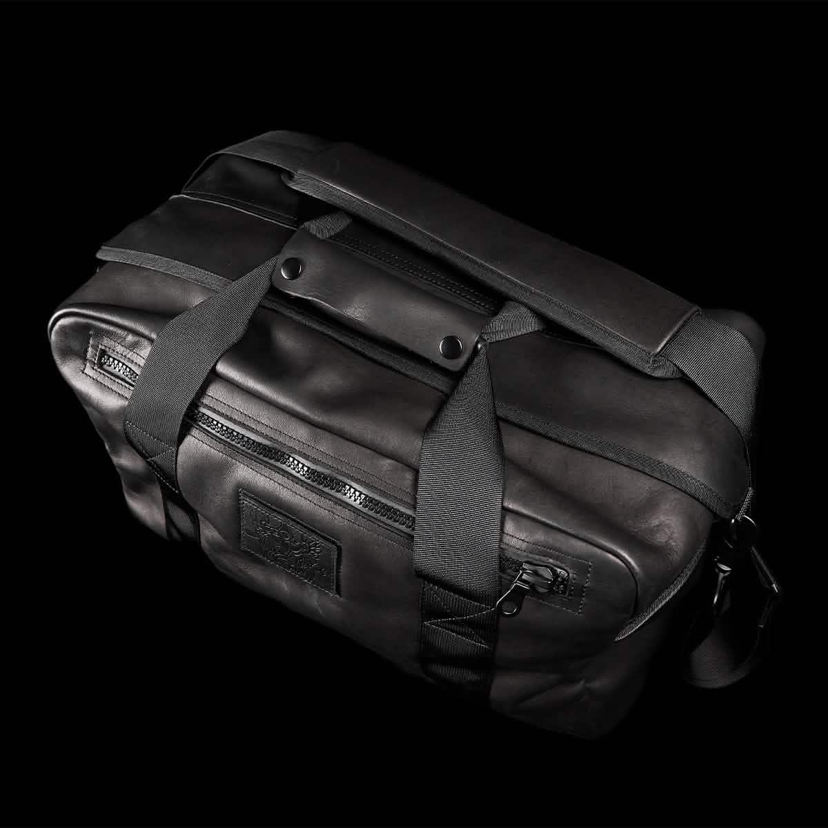 GORUCK black kit bag with rugged handles and zipper, shown on black background