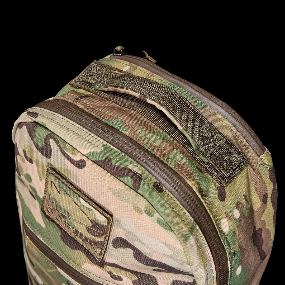 GORUCK Multicam 15L Bullet X-Pac rucksack closeup with rugged handle and patch, black background